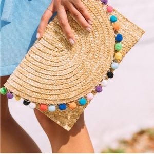 Francesca’s Rainbow Pom Pom Straw Clutch